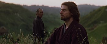 Movie still from “The Last Samurai” (2003), directed by Edward Zwick – A man in a robe standing next to another man in a robe; Close Up shot, Over the shoulder angle