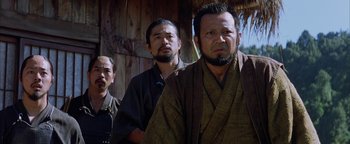 Movie still from “The Last Samurai” (2003), directed by Edward Zwick – A group of men standing next to each other; Medium shot, Low angle