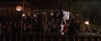 Movie still from “The Last Samurai” (2003), directed by Edward Zwick – A group of people watching a performance in a building; Extreme Wide shot, Low angle