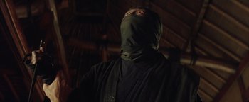 Movie still from “The Last Samurai” (2003), directed by Edward Zwick – A man with a black mask on his face; Close Up shot, Low angle