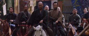 Movie still from “The Last Samurai” (2003), directed by Edward Zwick – A group of men riding on the back of a horse; Medium shot, Low angle