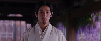 Movie still from “The Last Samurai” (2003), directed by Edward Zwick – A man in a white robe standing in front of a window; Close Up shot, Low angle