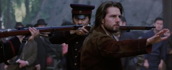 Movie still from “The Last Samurai” (2003), directed by Edward Zwick – Two men in military garb are holding guns; Close Up shot, Over the shoulder angle