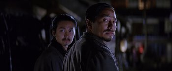 Movie still from “The Last Samurai” (2003), directed by Edward Zwick – Two asian men standing next to each other; Close Up shot, Low angle