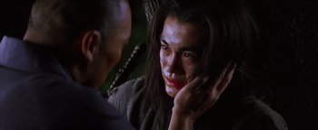 Movie still from “The Last Samurai” (2003), directed by Edward Zwick – A man with long black hair is looking into a mirror; Close Up shot, Over the shoulder angle