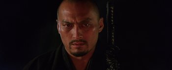 Movie still from “The Last Samurai” (2003), directed by Edward Zwick – A person holding a sword; Close Up shot, Low angle