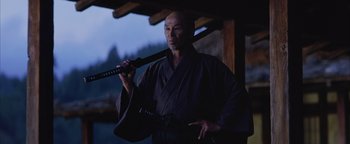 Movie still from “The Last Samurai” (2003), directed by Edward Zwick – A man holding a sword in his hand; Medium shot, Low angle
