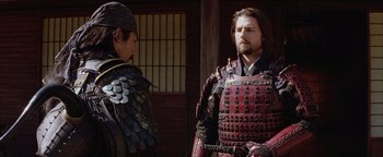 Movie still from “The Last Samurai” (2003), directed by Edward Zwick – Two men in samurai garb talking to each other; Close Up shot, Over the shoulder angle
