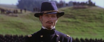 Movie still from “The Last Samurai” (2003), directed by Edward Zwick – A person wearing a uniform and a hat; Close Up shot, Low angle