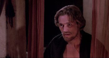 Movie still from “The Last Temptation of Christ” (1988), directed by Martin Scorsese – A person with a beard; Close Up shot, Over the shoulder angle