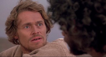 Movie still from “The Last Temptation of Christ” (1988), directed by Martin Scorsese – A person looking at another person; Close Up shot, Over the shoulder angle