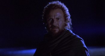 Movie still from “The Last Temptation of Christ” (1988), directed by Martin Scorsese – A person with a beard wearing a cape; Close Up shot, Low angle