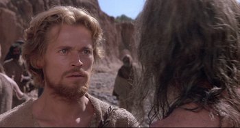 Movie still from “The Last Temptation of Christ” (1988), directed by Martin Scorsese – A man and a woman are standing in the dirt; Close Up shot, Over the shoulder angle