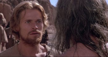 Movie still from “The Last Temptation of Christ” (1988), directed by Martin Scorsese – A person talking to another person; Close Up shot, Over the shoulder angle