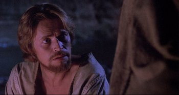 Movie still from “The Last Temptation of Christ” (1988), directed by Martin Scorsese – A person with a beard; Close Up shot, Over the shoulder angle