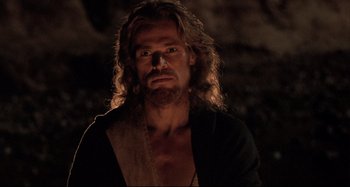 Movie still from “The Last Temptation of Christ” (1988), directed by Martin Scorsese – A man with long hair and a beard is posing for a picture; Close Up shot, Low angle