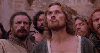 Movie still from “The Last Temptation of Christ” (1988), directed by Martin Scorsese – A group of men standing next to each other in a cave; Close Up shot, Low angle