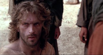 Movie still from “The Last Temptation of Christ” (1988), directed by Martin Scorsese – A person with long hair; Close Up shot, Over the shoulder angle