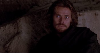 Movie still from “The Last Temptation of Christ” (1988), directed by Martin Scorsese – A person with long hair and a beard; Close Up shot, Low angle