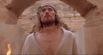 Movie still from “The Last Temptation of Christ” (1988), directed by Martin Scorsese – A person with a beard wearing a crown; Close Up shot, Low angle