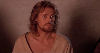 Movie still from “The Last Temptation of Christ” (1988), directed by Martin Scorsese – A person with long hair and a beard; Close Up shot, Low angle