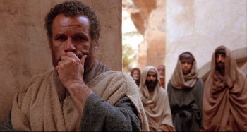 Movie still from “The Last Temptation of Christ” (1988), directed by Martin Scorsese – A group of men standing next to each other; Medium shot, Low angle