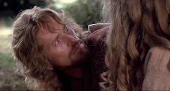 Movie still from “The Last Temptation of Christ” (1988), directed by Martin Scorsese – A person with long hair and a beard; Close Up shot, Over the shoulder angle