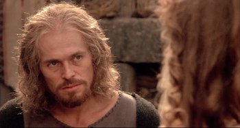 Movie still from “The Last Temptation of Christ” (1988), directed by Martin Scorsese – A man with long hair and a beard looking at himself in a mirror; Close Up shot, Over the shoulder angle