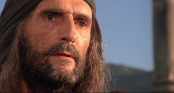 Movie still from “The Last Temptation of Christ” (1988), directed by Martin Scorsese – A person with long hair and a beard; Close Up shot, Low angle