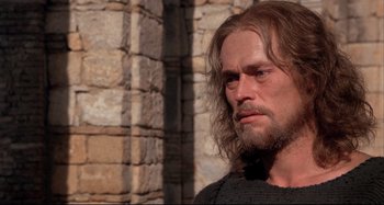 Movie still from “The Last Temptation of Christ” (1988), directed by Martin Scorsese – A person with long hair and a beard; Close Up shot, Low angle