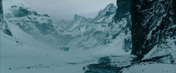 Movie still from “The Last Witch Hunter” (2015), directed by Breck Eisner – A snowy mountain with a river in the foreground; Extreme Wide shot, High angle