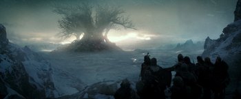 Movie still from “The Last Witch Hunter” (2015), directed by Breck Eisner – A group of people standing on top of a snow covered field; Extreme Wide shot, Low angle
