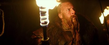 Movie still from “The Last Witch Hunter” (2015), directed by Breck Eisner – A man with long hair and a long beard is holding a sword; Close Up shot, Low angle
