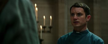 Movie still from “The Last Witch Hunter” (2015), directed by Breck Eisner – A man standing in front of a group of candles; Close Up shot, Over the shoulder angle