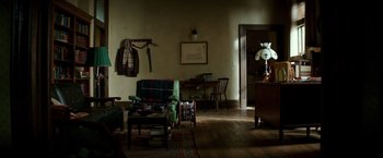 Movie still from “The Last Witch Hunter” (2015), directed by Breck Eisner – A living room filled with furniture next to a table; Wide shot, High angle