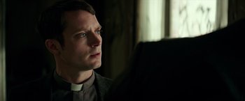 Movie still from “The Last Witch Hunter” (2015), directed by Breck Eisner – A man wearing a priest's outfit looking into a window; Close Up shot, Over the shoulder angle