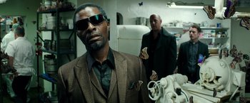 Movie still from “The Last Witch Hunter” (2015), directed by Breck Eisner – A man in a suit and sunglasses next to another man in a suit and sunglasses; Close Up shot, Low angle
