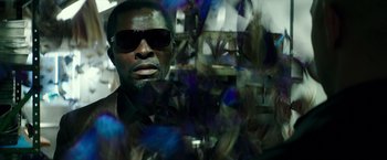 Movie still from “The Last Witch Hunter” (2015), directed by Breck Eisner – A man wearing sunglasses and a black shirt; Close Up shot, Over the shoulder angle