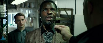 Movie still from “The Last Witch Hunter” (2015), directed by Breck Eisner – A man with blue eyes is holding a pipe in his mouth; Close Up shot, Over the shoulder angle