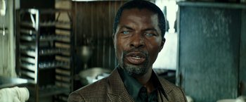 Movie still from “The Last Witch Hunter” (2015), directed by Breck Eisner – A person wearing a suit and tie; Close Up shot, Over the shoulder angle