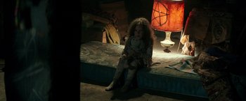 Movie still from “The Last Witch Hunter” (2015), directed by Breck Eisner – A little girl sitting on a bed holding a stuffed animal; Medium shot, High angle