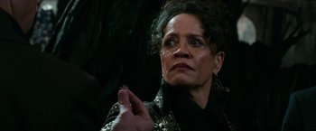 Movie still from “The Last Witch Hunter” (2015), directed by Breck Eisner – An older woman holding a piece of paper in her hand; Close Up shot, High angle