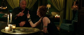 Movie still from “The Last Witch Hunter” (2015), directed by Breck Eisner – A man and a woman sitting at a dinner table; Medium shot, Over the shoulder angle