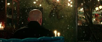 Movie still from “The Last Witch Hunter” (2015), directed by Breck Eisner – A man sitting in front of a christmas tree with candles; Extreme Close Up shot, Low angle