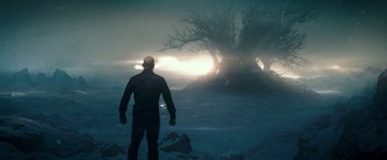 Movie still from “The Last Witch Hunter” (2015), directed by Breck Eisner – A man standing in front of a tree in the fog; Wide shot, Low angle