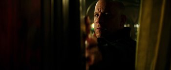 Movie still from “The Last Witch Hunter” (2015), directed by Breck Eisner – A man with bald head looking into a mirror; Close Up shot, Low angle