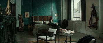 Movie still from “The Last Witch Hunter” (2015), directed by Breck Eisner – A woman sitting on a bed next to a window; Wide shot, High angle