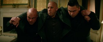 Movie still from “The Last Witch Hunter” (2015), directed by Breck Eisner – A group of men standing next to each other in a room; Medium shot, Low angle
