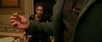 Movie still from “The Last Witch Hunter” (2015), directed by Breck Eisner – A woman sitting in front of a mirror looking at the camera; Medium shot, Over the shoulder angle