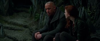 Movie still from “The Last Witch Hunter” (2015), directed by Breck Eisner – A man and a woman sitting next to each other on the ground; Medium shot, Over the shoulder angle